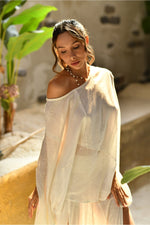 An enchanting Bohemian Leila, perfect for boho and festival-inspired looks, exuding a goddess-like quality. The flowy fabric and intricate side details create an ethereal, bohemian style perfect for Burning Man and other occasions. This garment is an ethically crafted gem. Menswear Boho Shirt. Boho sleeveless poncho unisex