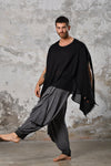 An enchanting Bohemian black poncho blouse unisex, perfect for boho and festival-inspired looks, exuding a goddess-like quality. black bohemian style perfect for Burning Man and other occasions. Menswear Boho Shirt. Boho sleeveless poncho unisex yogi