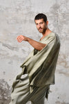 An enchanting Bohemian Leila, perfect for boho and festival-inspired looks, exuding a goddess-like quality. Green bohemian style perfect for Burning Man and other occasions. Menswear Boho Shirt. Boho sleeveless poncho unisex