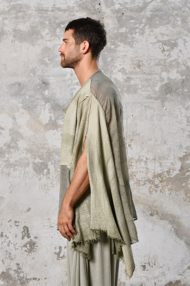 An enchanting Bohemian Leila, perfect for boho and festival-inspired looks, exuding a goddess-like quality. Green bohemian style perfect for Burning Man and other occasions. Menswear Boho Shirt. Boho sleeveless poncho unisex