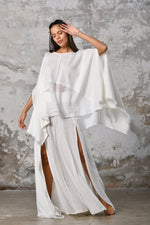 An enchanting Bohemian Leila, perfect for boho and festival-inspired looks, exuding a goddess-like quality. The flowy fabric and intricate side details create an ethereal, bohemian style perfect for Burning Man and other occasions. This garment is an ethically crafted gem. Menswear Boho Shirt. Boho sleeveless poncho unisex