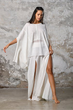 An enchanting Bohemian Leila, perfect for boho and festival-inspired looks, exuding a goddess-like quality. The flowy fabric and intricate side details create an ethereal, bohemian style perfect for Burning Man and other occasions. This garment is an ethically crafted gem. Menswear Boho Shirt. Boho sleeveless poncho unisex